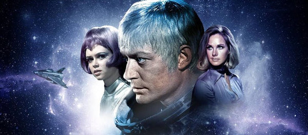 Ed Straker with women from the SHADO team in UFO artwork