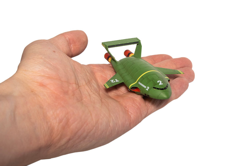 Thunderbird 2 held in a hand to show its compact size.